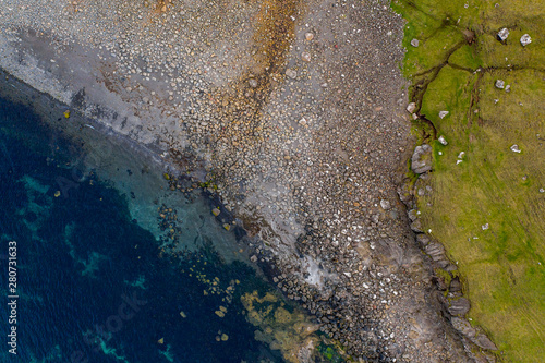 Rock beach in Sandoy island - aerial drone view, Faroe Islands