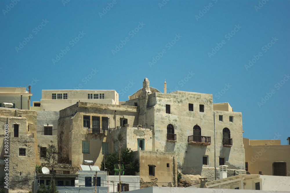 Greece, the island of Naxos, Naxos Town. A detail of the old defensive Kastro that rises above the modern harbor.  The houses doubled as a defensive wall.