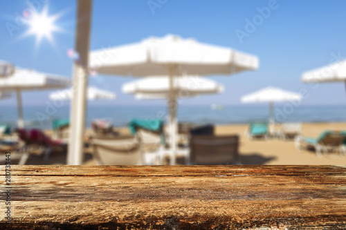 Summer background of beach and wooden desk of free space  © magdal3na