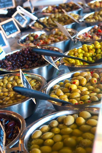 Variety of green and black olives on farmer market