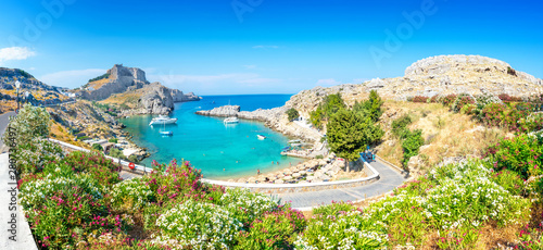 Lindos – panoramic view of St. Paul bay with acropolis of Lindos in background (Rhodes, Greece) photo