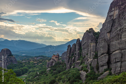 Meteora - incredible sandstone rock formations.  The Meteora area is on UNESCO World Heritage List since 1988. Monastery of Agios Nikolaos Anapafsas in center. Greece