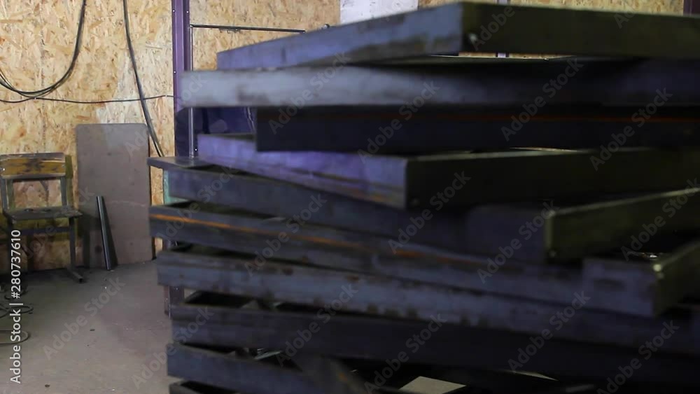 Cutting metal into individual blanks is a technological process. In this video, a man cuts metal. Cutting metal into individual blanks is a technological process. In this video, a man cuts metal.