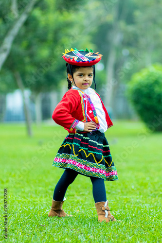 Peruvian girl dressed in typical costume of Cusco, Peru photo