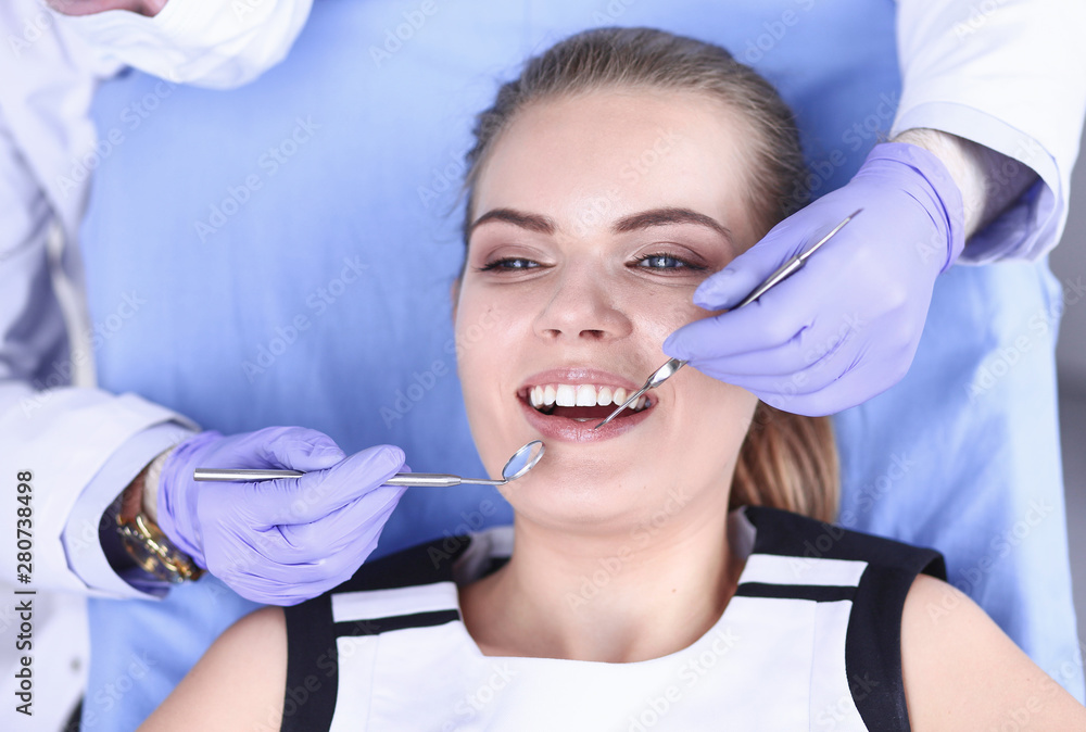 beautiful girl in the dental chair on the examination at the de beautiful girl in the dental chair on the examination at the de