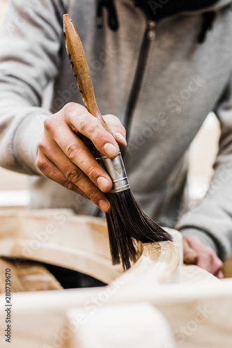 carpenter painting wood