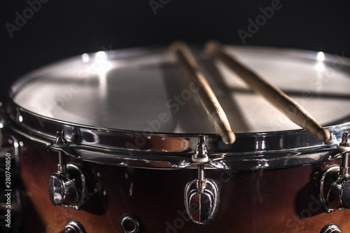 Sticker Drum set in a dark room against the backdrop of the spotlight