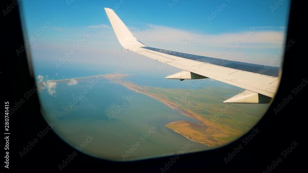 Plane taking off from airport, View through an airplane window Plane taking off from airport, View through an airplane window