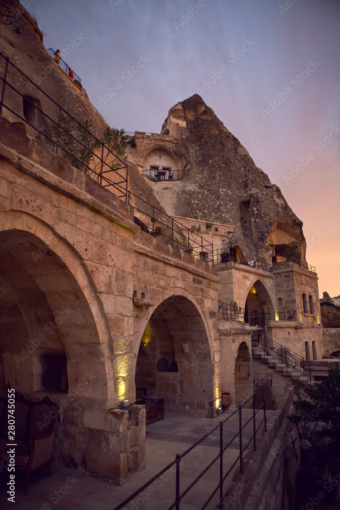 old town of goreme in Turkey, the houses and the fortress at sunset