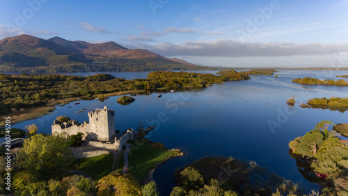 Ancient Castle in Killarney National Park during early morning, Ring of Kerry, Ireland photo