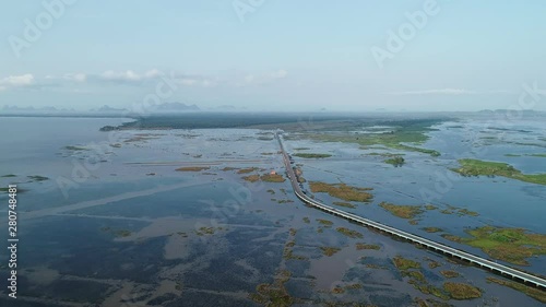 Wallpaper Mural Aerial view Drone shot of Bridge(Ekachai bridge)Colorful Road bridge cross the lake at Talay Noi Lake in Phatthalung province Thailand Torontodigital.ca