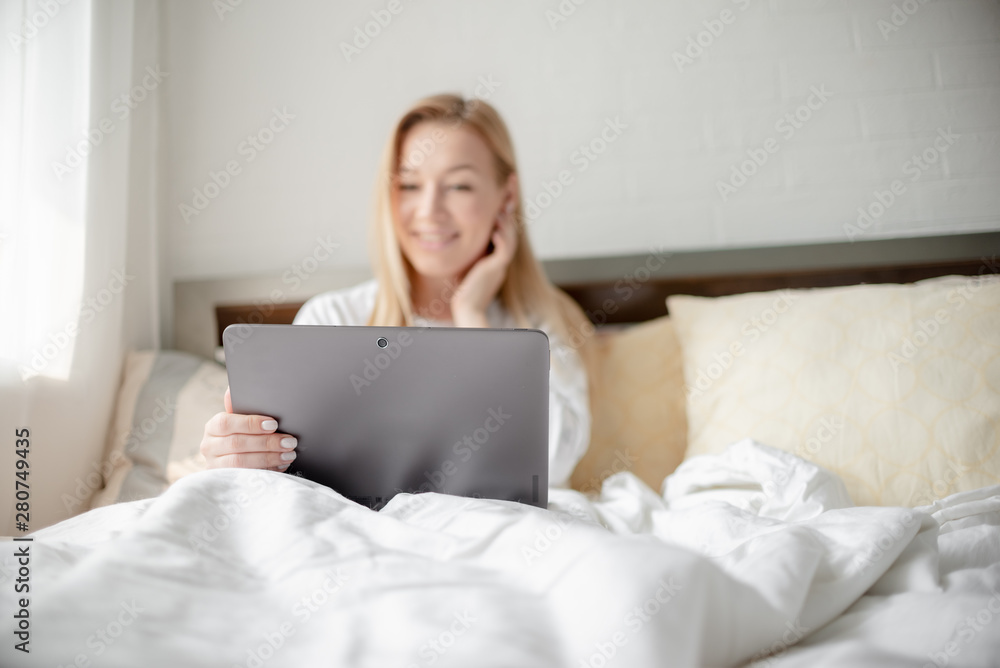 Work from home concept . Blonde Giirl typing and using laptop. Hygge Horizontal copyspace Work from home concept . Blonde Giirl typing and using laptop. Hygge Horizontal copyspace