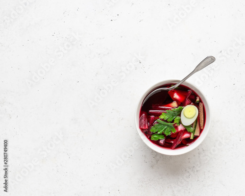 Summer cold beet soup with eggs, cucumber, potatoes and greens