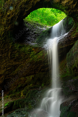 Fototapeta Naklejka Na Ścianę i Meble -  Long exposure Murgul Deliklikaya waterfall over brown and green rocks.