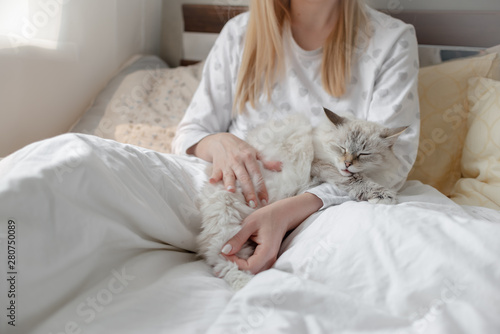 Good morning concept blonde girl with the cat and coffee cup hygge lagom concept. Horizontal copyspace