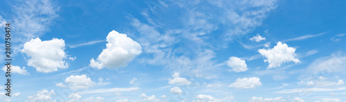 Panorama of blue sky with white clouds in clear weather on a sunny day  bright sky  panorama  background  copy space