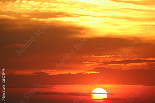 sunset on red orange sky back soft evening cloud over horizon sea © darkfoxelixir