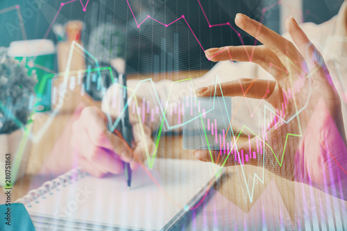 Forex chart displayed on woman's hand taking notes background. Concept of research. Multi exposure