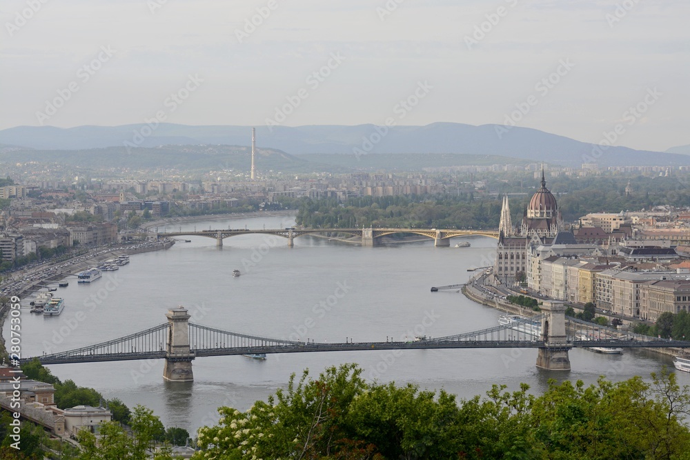 Fototapeta premium Neo-Gothic Parliament building is the largest and most beautiful in Hungary. The residence of Parliament stands on the banks of the Danube in Budapest. The building was built in neo-gothic style.