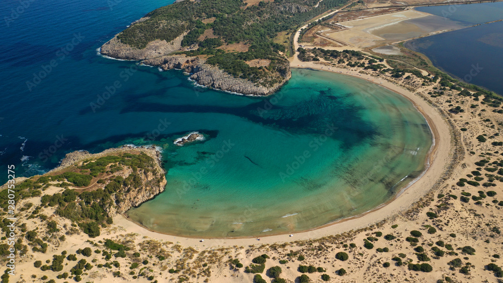 Fototapeta premium Aerial drone view of semicircular sandy beach and lagoon of Voidokilia, one of the most iconic beaches in Mediterranean sea, with crystal clear turquoise sea, Messinia, Greece