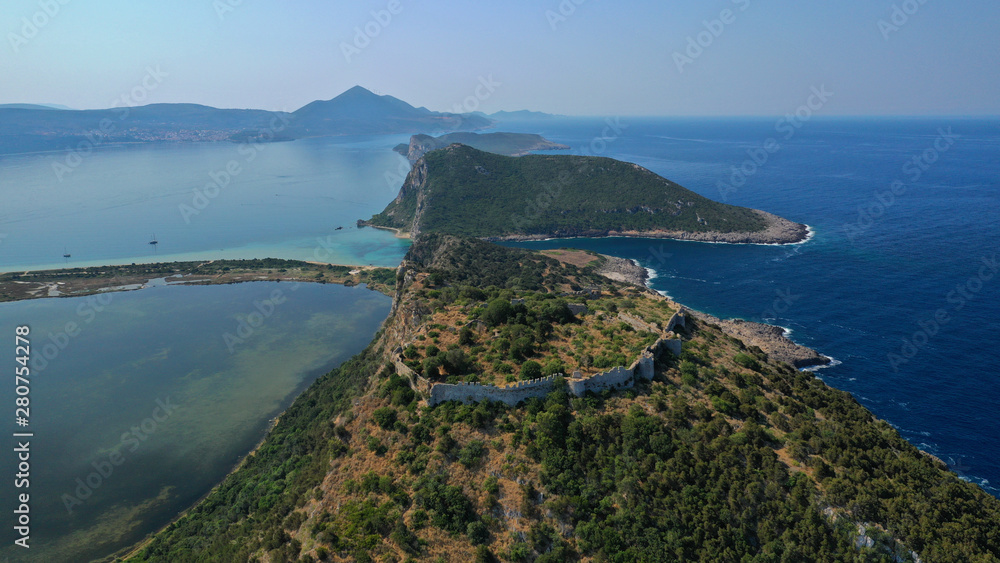Aerial drone panoramic view of tropical iconic exotic beach of Voidokoilia as seen from Palaiokastro (literally 