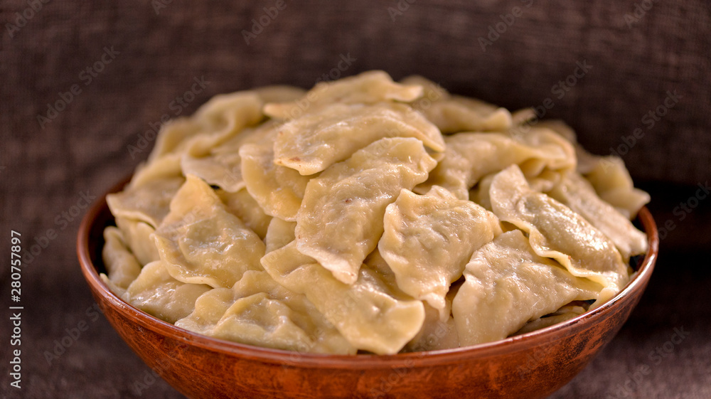 cooked dumplings in a large plate close-up cooked dumplings in a large plate close-up