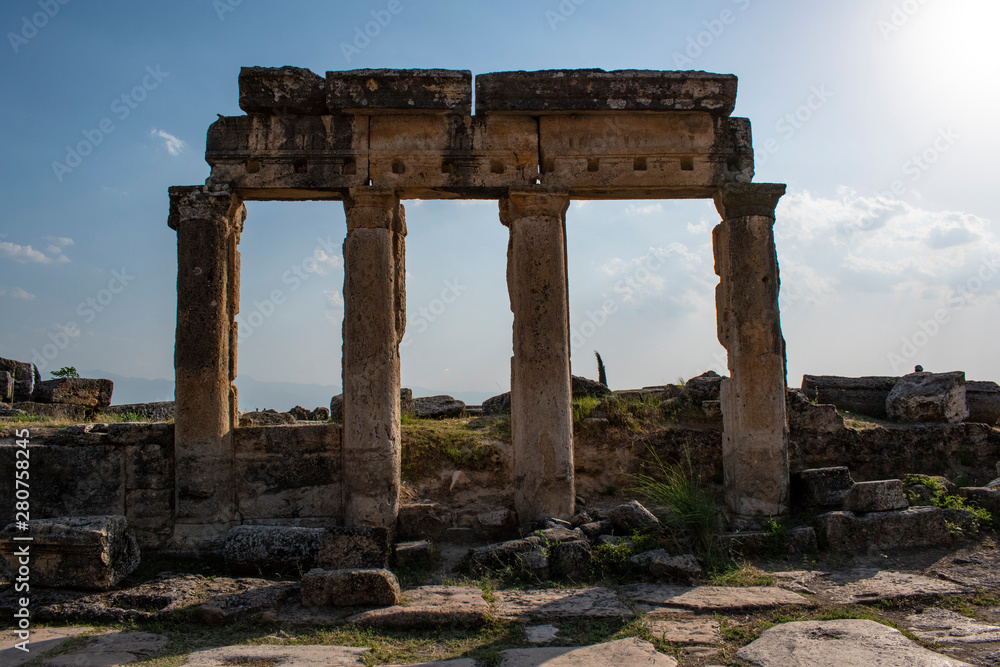 Naklejka premium Turkey: building on Frontinus Street, the main street to the Roman city of Hierapolis (Holy City), ancient city located on hot springs in classical Phrygia whose ruins are near Pamukkale