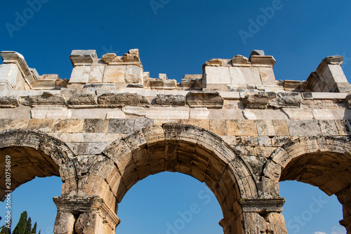 Turkey: the Frontinus Gate, the monumental entrance to the Roman city of Hierapolis (Holy City), the ancient city located on hot springs in classical Phrygia whose ruins are near Pamukkale 