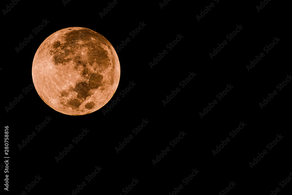 Obraz premium Portrait of moon with red color and dark background