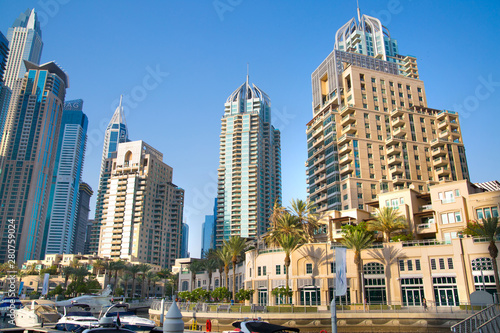 Dubai  UAE United Arabs Emirates. Dubai marina skyscrapers and yachts at sunset. Apartments  hotels and office buildings  modern residential development of UAE