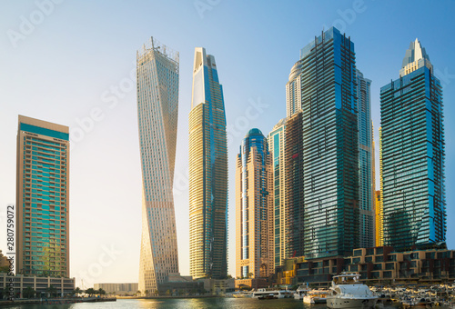 Dubai, UAE United Arabs Emirates. Dubai marina skyscrapers and yachts at sunset. Apartments, hotels and office buildings, modern residential development of UAE © IRStone