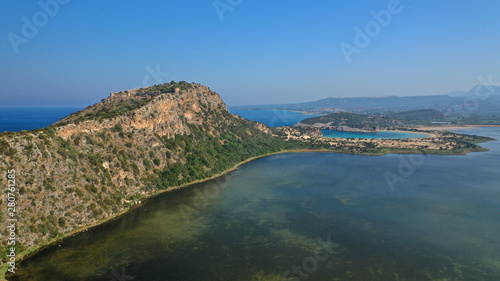 Aerial drone photo of iconic secluded sandy beach with emerald sea in island of Sfaktiria next to bay and famous beach of Divari (chrysi akti), Messinia, Gialova, Peloponnese, Greece photo