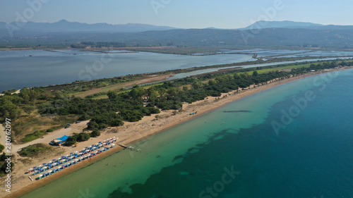 Aerial drone photo of iconic sandy beach of Divari (chrysi akti) with emerald sea near island of Sfaktiria in bay of Navarino, Messinia, Gialova, Peloponnese, Greece © aerial-drone