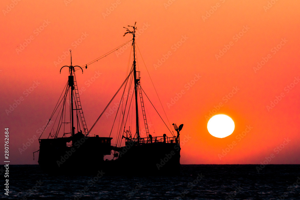 Amazing Sunset and ship in Taganga beach, Colombia
