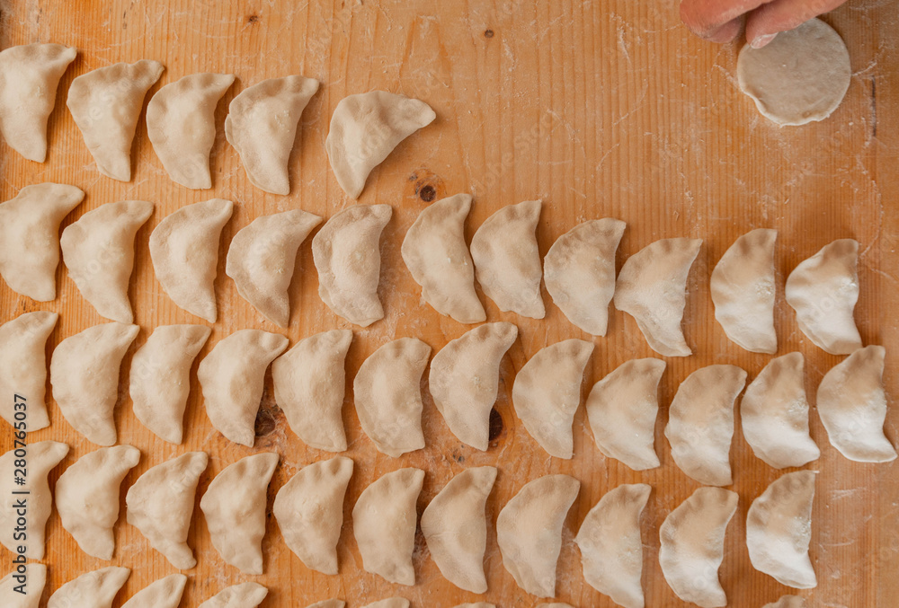 Fototapeta premium Traditional Ukrainian dish vareniki or Italian ravioli.