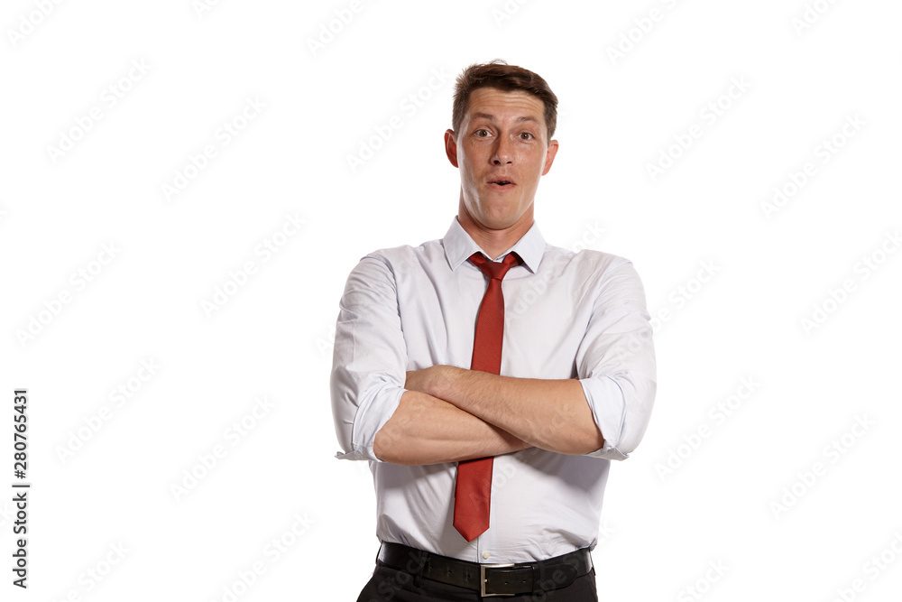 Portrait of a young brunet man posing in a studio isolated over a white background. Portrait of a young brunet man posing in a studio isolated over a white background.