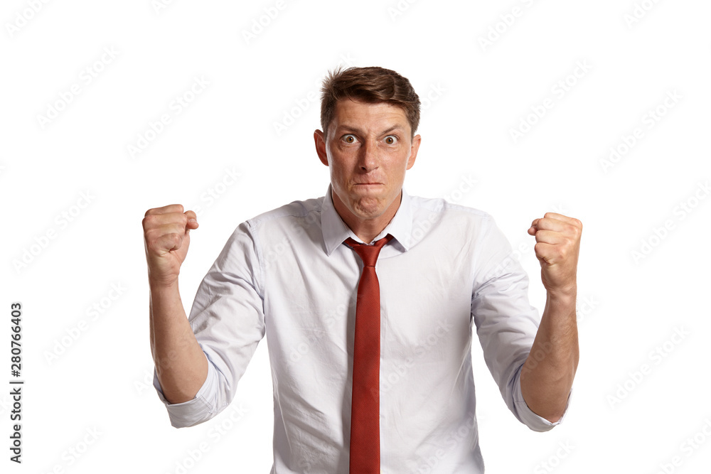 Portrait of a young brunet man posing in a studio isolated over a white background. Portrait of a young brunet man posing in a studio isolated over a white background.