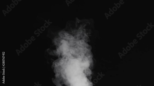 Slow motion of water vapor stream comes from below over black background photo