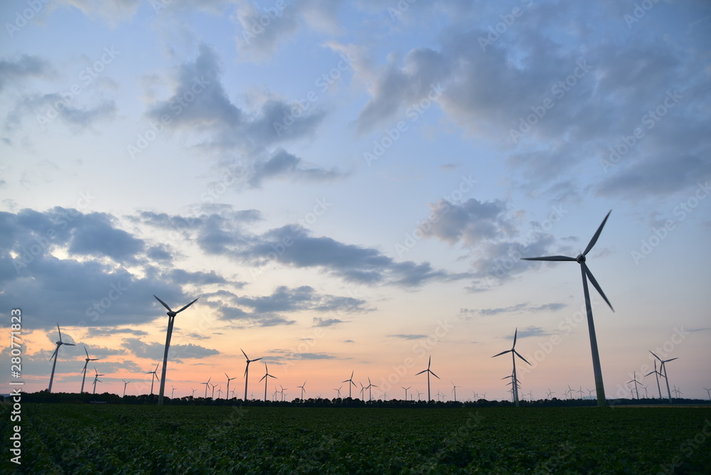 Wind turbines for green energy generation at dusk in Burgenland. Wind turbines for green energy generation at dusk in Burgenland.