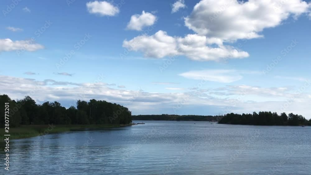 Beautiful view of summer lake in forest. Duck and birds walk and swim near with beach. Sunset, sunrise and daylight. Beautiful view of summer lake in forest. Duck and birds walk and swim near with beach. Sunset, sunrise and daylight.