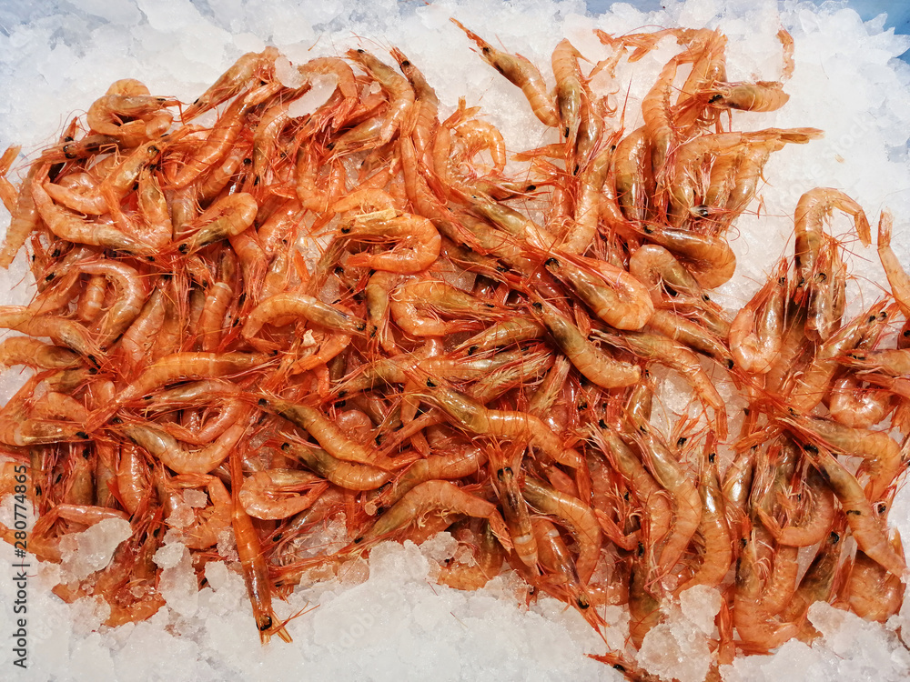 red prawns exposed on ice for sale