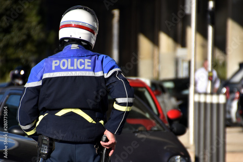 policeman with hand on his gun