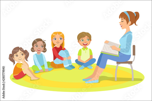 Group Of Small Kids Sitting Around The Teacher Reading A Story