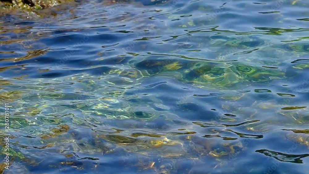 Crystal clear and calm waters in the sea of the coast of Catalonia in the middle of summer, holiday concept Crystal clear and calm waters in the sea of the coast of Catalonia in the middle of summer, holiday concept