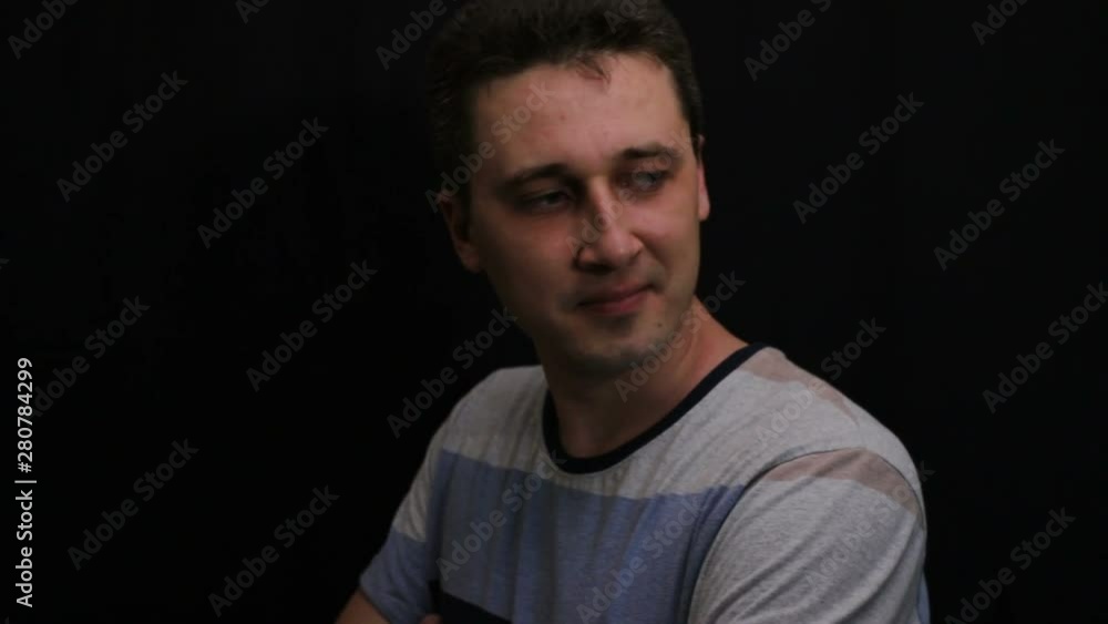 unhappy young handsome caucasian man shows his emotion close-up unhappy young handsome caucasian man shows his emotion close-up