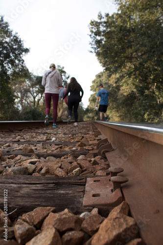 people on train tracks