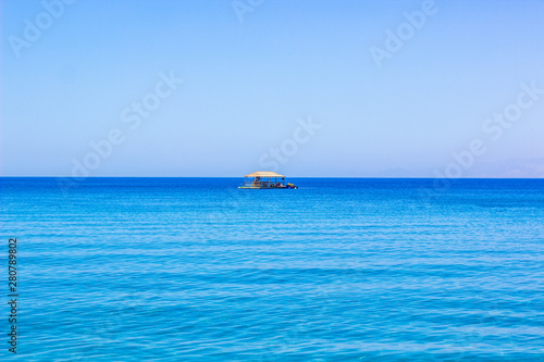 calm and peaceful photography of wooden gazebo floating on calm Red sea water surface exceptional hotel apartment entertainment object for reach people, horizontal background with empty space for text © Артём Князь