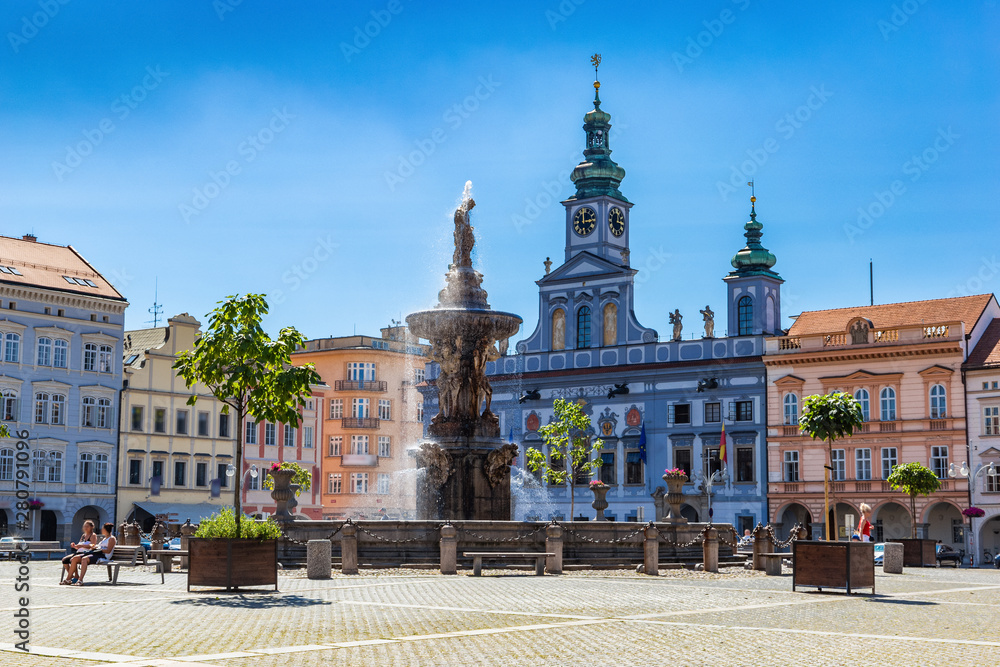 Main square with Samson fighting the lion fountain sculpture and bell tower in Ceske Budejovice. Czech Republic.