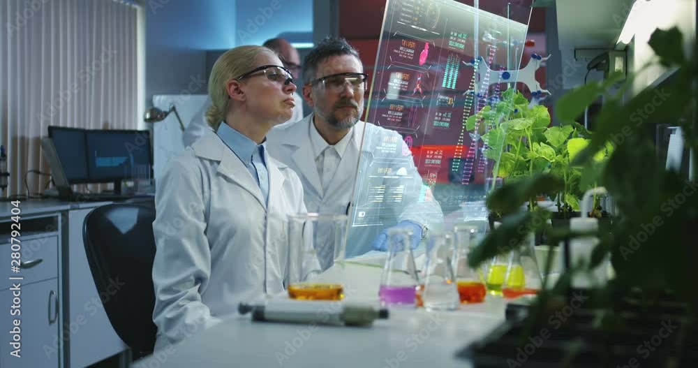Scientists using a holographic display screen Scientists using a holographic display screen