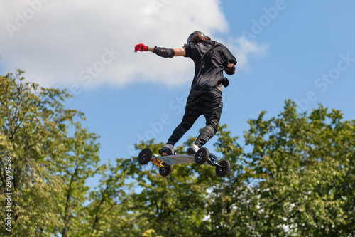 Extreme jumping on a mountainboard at the Moscow sports festival in Luzhniki. Danger, fall, shock photo